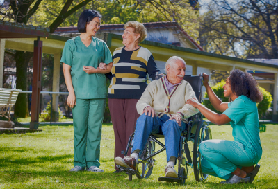 senior woman and man with their caregiver